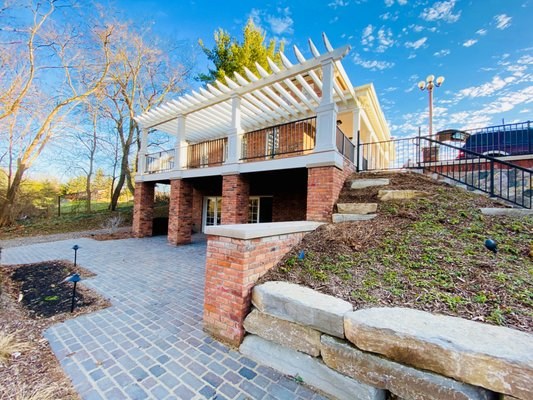 The Brighton Lighthouse — brick terrace and white pergola, Brighton, Michigan
