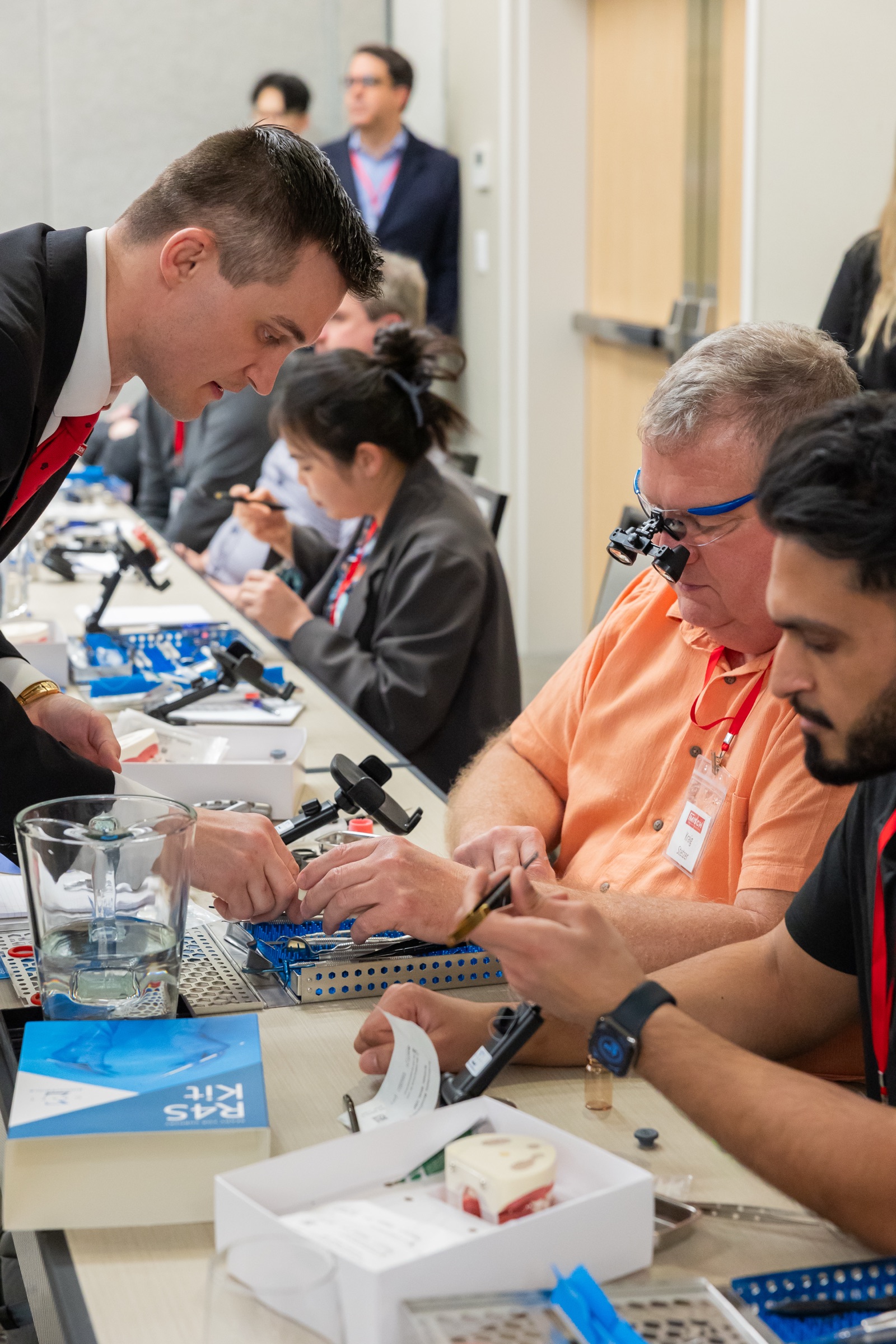 Bench instruction during a Misch Implant Institute course